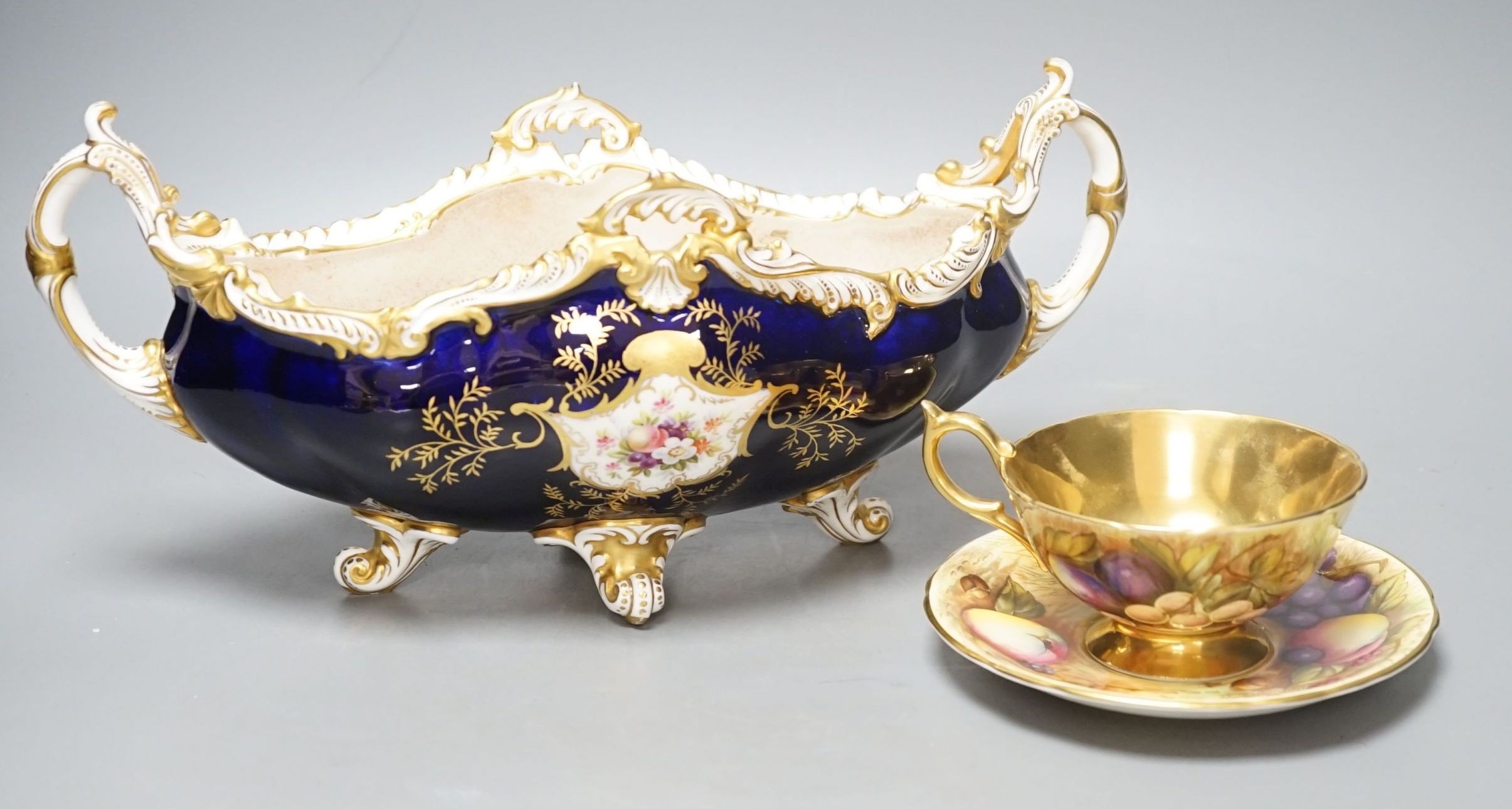 A Coalport navette shaped bowl, pattern v5146, 34cm long, and an Aynsley cup and saucer, pattern 946